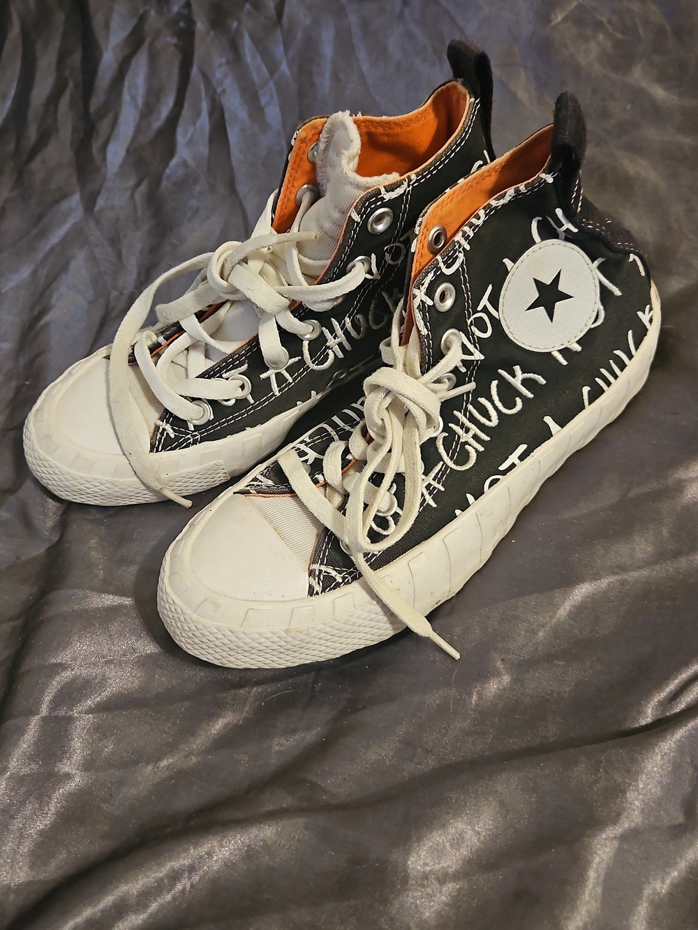 Converse Black and White High-Top Sneakers with Orange Lining